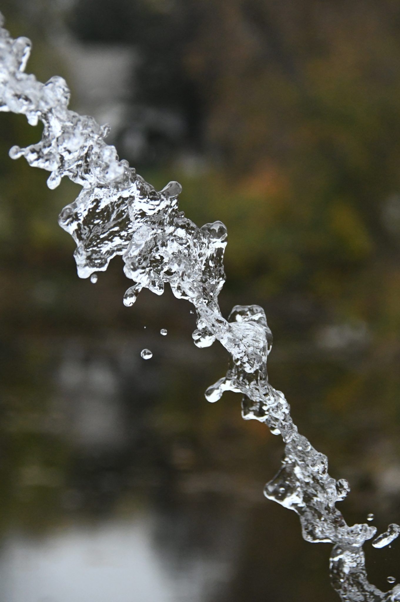 Closeup of a water stream with blurred background, meant to represent social media for nonprofits revenue streamit