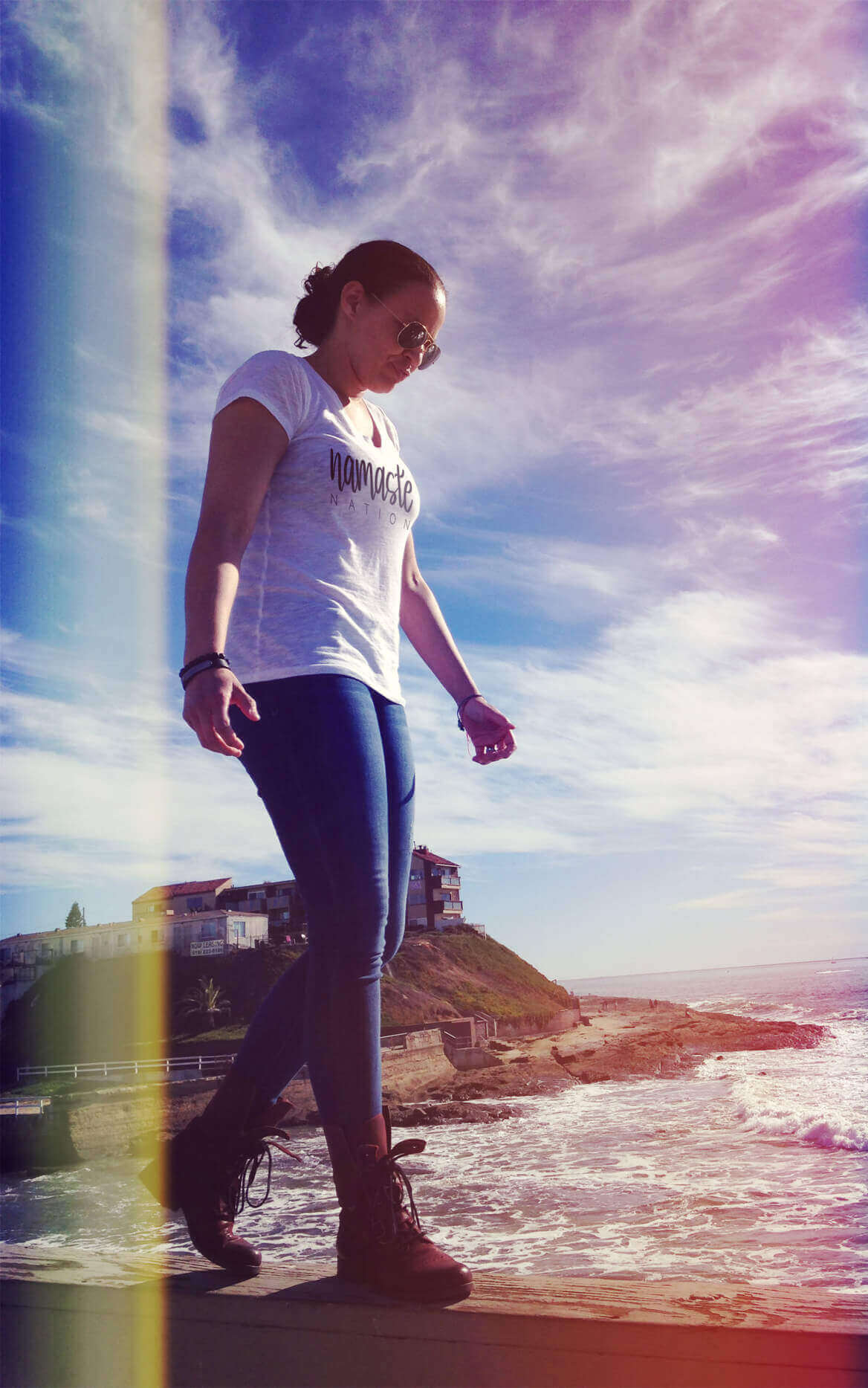 Kristine Mason Broadus, Vice president and owner of Puzzle Pieces Marketing walking on the pier in the sun in san diego california